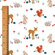 Load image into Gallery viewer, graphic of forest friends fabric design with wooden ruler to show scale
