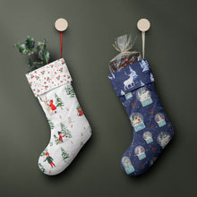 Load image into Gallery viewer, Snow Globe Blue fabric used to make a stocking alongside a stocking made from Arctic Kids fabric.
