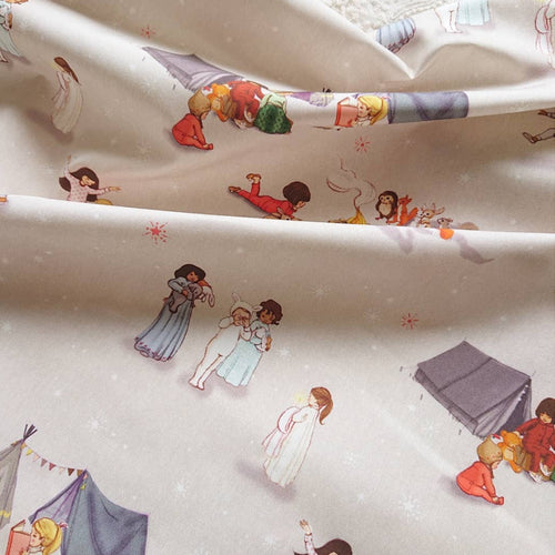 details photo of children's fabric bedtime stories. it has  a grey starry background with images of children dancing, and reading campfire stories 