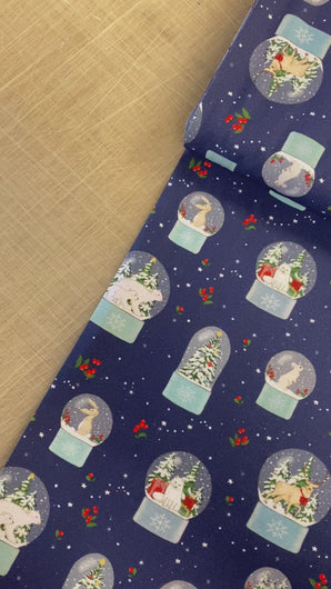 Video of Snow Globe Blue fabric. Shows details of the snow globes, berries, polar bears, bunnies, and elk on the fabric