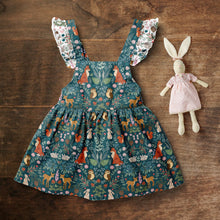 Load image into Gallery viewer, image of children&#39;s dress sewn with midnight forest woodland fabric
