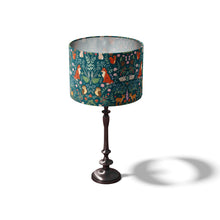 Load image into Gallery viewer, 25cm x 25cm lampshade for a table lamp. Teal green in colour, it is adorned with illustrations of woodland animals and florals in a william morris style pattern. 

